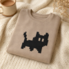 Sweat chat noir plie en flat-lay cosy